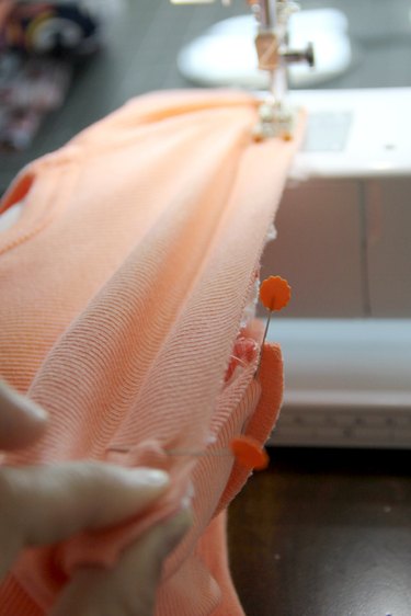 Stretch the tank top as you sew