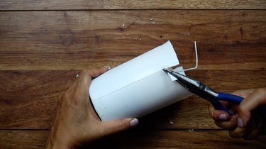 Removing DIY candles with cement base from mold with long nose pliers
