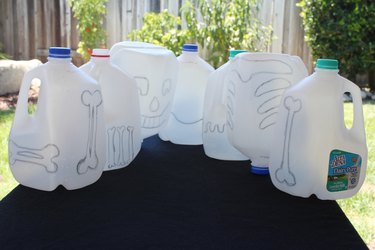 bones drawn on milk jugs