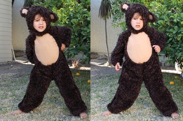 Child dressed in bear costume.