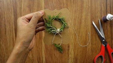 DIY rosemary Christmas wreath gift tag.