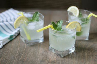 Three glasses of sparkling lemonade with mint garnish