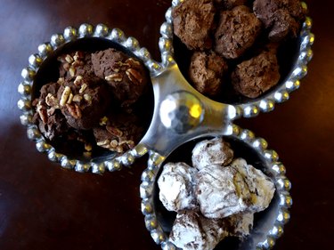 Easy low-carb truffles with three toppings: powdered sweetener, pecans, and cocoa powder.