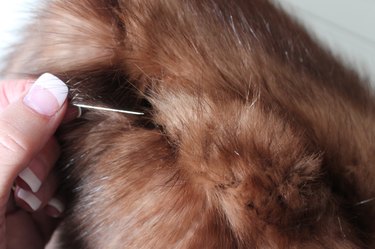 use a pin to free fur caught in the seam