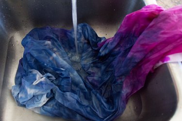 Rinse fabric with cold water.