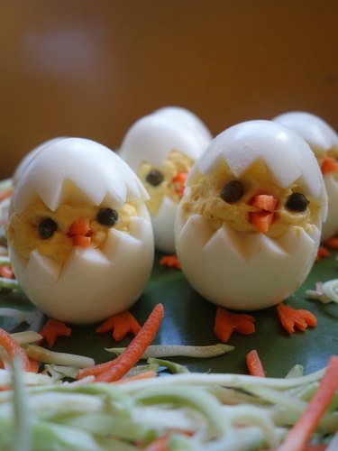 Deviled egg Easter chicks on plate.