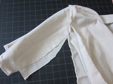 Sew sleeve to robe