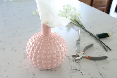 Put paper towels inside vase