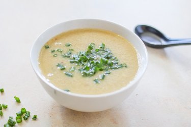 Bowl of egg drop soup with green onion