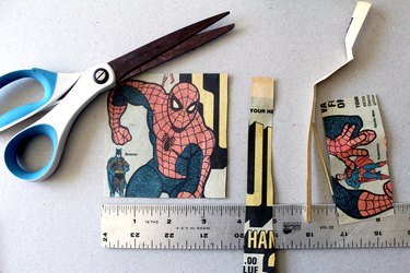 cut a square piece of comic book paper for slate coasters