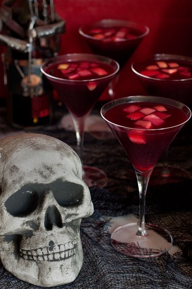Close up of sangria glasses and skull