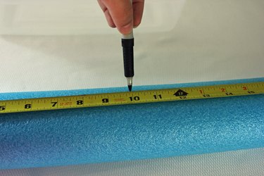 Use a marker to mark the new length on the pool noodle