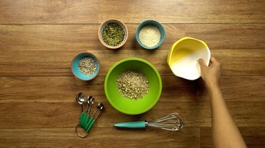 Mixing nuts and seeds for healthy seed and nut crispbread crackers.