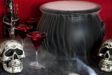 Smokey cauldron with sangria glasses and skulls