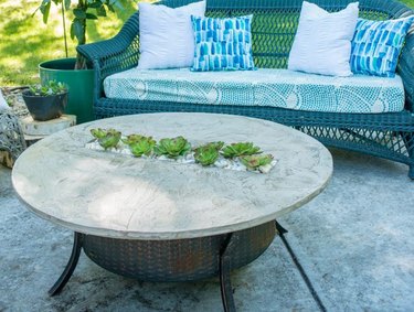 Faux cement finish fire pit cover with succulent insert