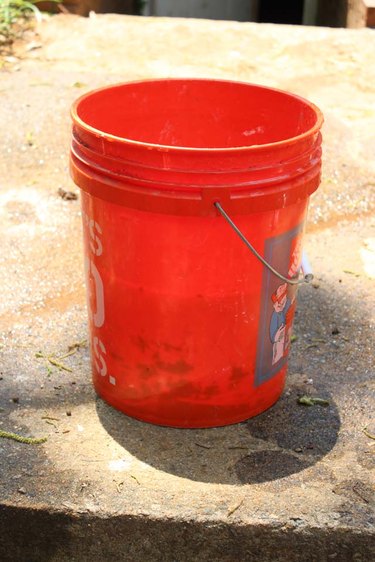 Pour hot water into the bucket.