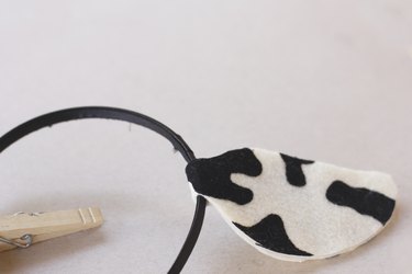 ...A fabric cow ear wrapped around a black headband to make a DIY cow ear headband