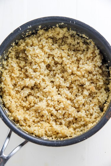 Cook quinoa and transfer it to a large bowl.