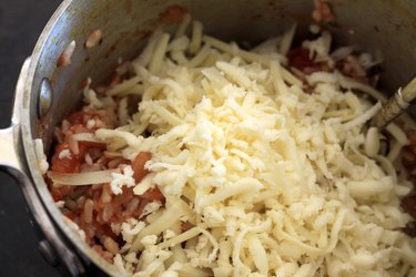 Cheese, rice, and salsa in a pan