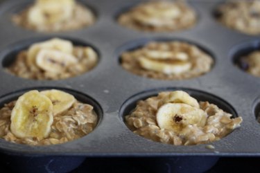 Oatmeal protein muffins with banana chips on top.