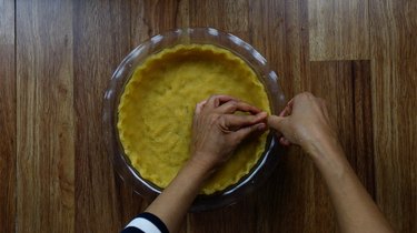 Crimping edges of almond flour no-roll gluten-free low-carb pie crust.