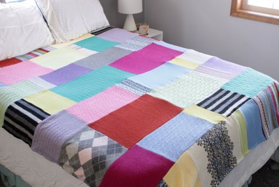 Snuggle up with a good book, a warm cup of tea, and your favorite jammies under this upcycled sweater quilt that you made yourself.
