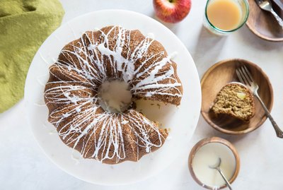 top down image of apple cider bundt cake with slice taken out