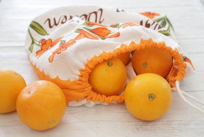 These eco-friendly bags can be made from fabric you already have or thrift shop dishtowels or curtain panels to make them double earth friendly.