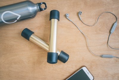 DIY gold and black dumbbells with PVC pipes