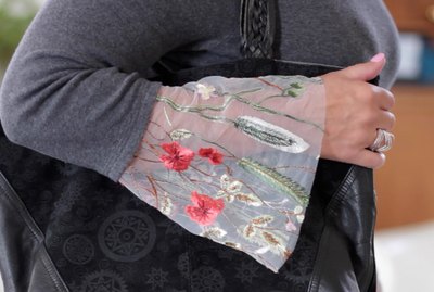 If you'd like to add some fun unexpected detail to an otherwise plain sweater or shirt, a bell sleeve is a nice option. You can use plain fabric to match your shirt or make a fashion statement using something more colorful like an embroidered mesh.
