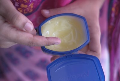women hand using vaseline