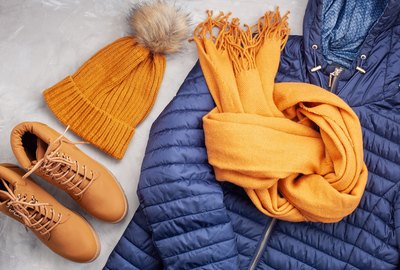 Flat lay with comfort warm outfit for cold weather. Comfortable autumn, winter clothes shopping, sale, style in trendy colors idea