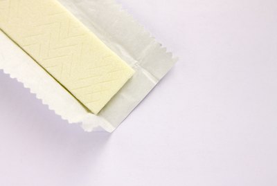 Plate of chewing gum in an open wrapper on a white background