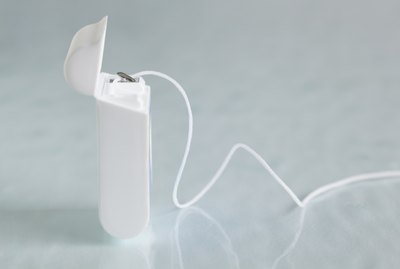 closeup of dental floss and dispenser
