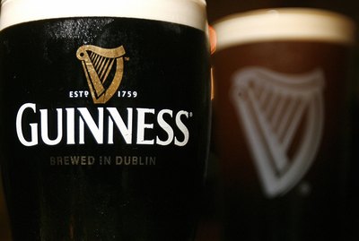 Pints of Guinness beer are pictured in L