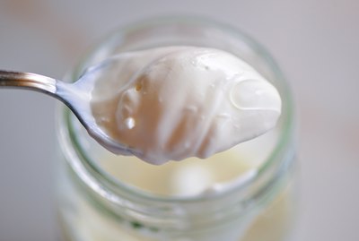 Close-Up Of Yogurt On Spoon