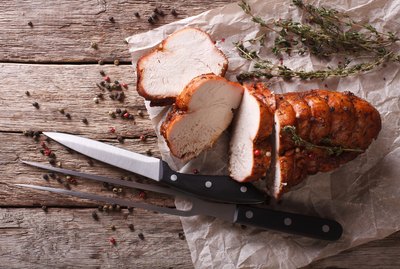 rustic food: roasted turkey breast on table. horizontal top view