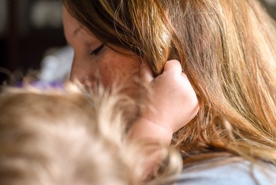 Close-Up Of Woman With Daughter At Home