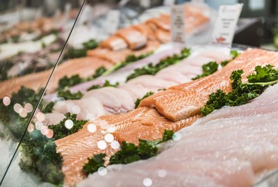 Seafood stand with cuts and filets of salmon and tuna