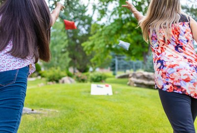Two Adult Senior Female Friends Having Fun Together Outdoors