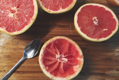 Halved Pink Grapefruit On Table