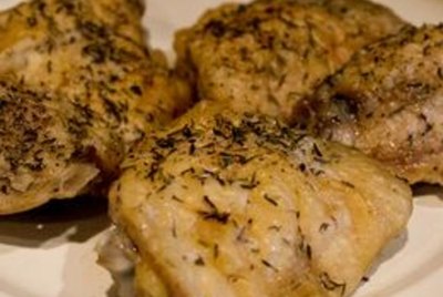pile of cut chicken with knife