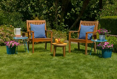 beautiful backyard with wooden chairs and flowers