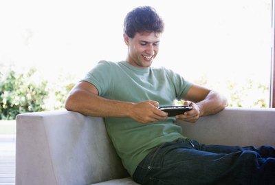 Man playing handheld video game