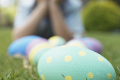 Boy and Easter eggs on lawn (focus on foreground)