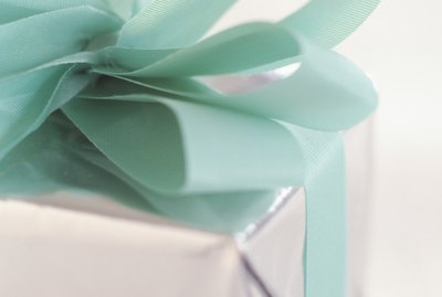 Christmas gift wrapped with bow, close-up