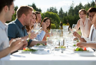People enjoying outdoor dinner party