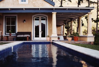 view of a swimming pool in the backyard of a house