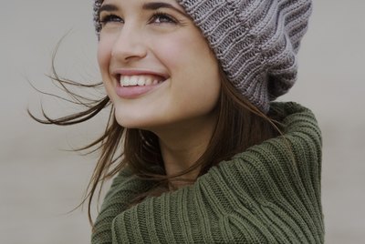 Woman in sweater and cap