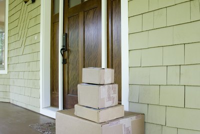Stack of moving and/or mailing boxes by front door